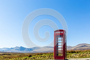 Red telephone box at a remote location