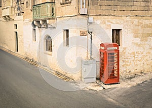 Red telephone cabin in the old town of Victoria in Gozo Malta