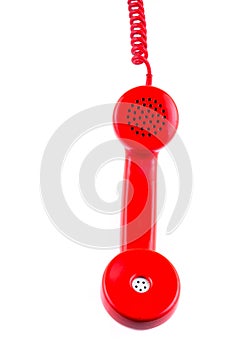 Red telephone receiver on white background.