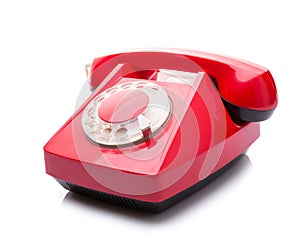 Red telephone on white