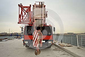 Red telescopic crane, road works