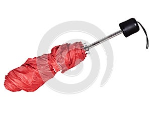 Red telescopic umbrella, part furled. Isolated on white background.
