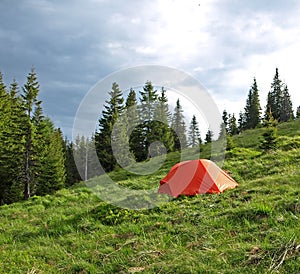 Red tent set in wilderness