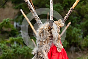 Red textile and animal on teepee structure