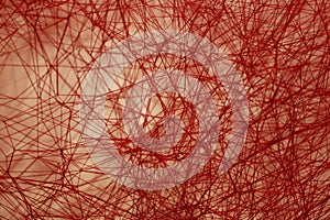 Red textural background of interwoven string