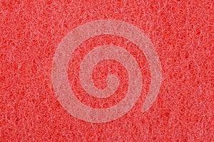 The red texture of the sponge is foam.The background of red foam