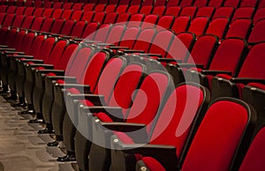 Red theater seats in rows at a movie theater or playhouse