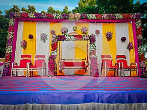 red themed wedding stage,Indian Wedding Stage.Indian wedding decoration. Indian beautiful marriage decoration with flowers