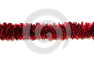 Red tinsel isolated on white background