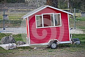 Red Tiny House, the transportable mini house on wheels photo
