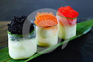 Red and tobiko caviar topped sushi rolls set