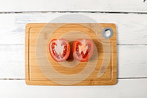 Red tomato cut in half. Fresh food and vitamins