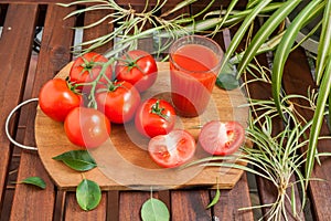 Red tomato and juice in