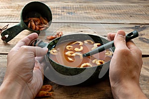 Red tomato soup with shrimp. Dish with tomatoes and prawns