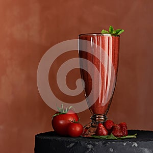 Red tomato, strawberries and mint smoothie. Dietary vitamin cocktail for weight loss. Glass with healthy fresh juice or