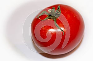 Red tomato on a white background