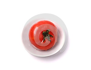 Red tomato on the white background