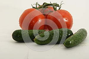 Red tomatoes and green cucumbers
