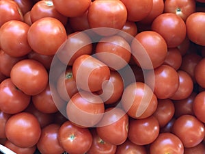 Red tomatoes in pile tomatoes are important part of kitchen vegetable