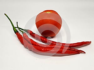 Red tomatoes and red chilies, typical Indonesian and Asian spices, are known to be very delicious and nutritious foods