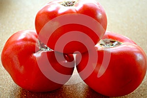 red tomatoes on a table.fresh tomatoes isolated on cork background