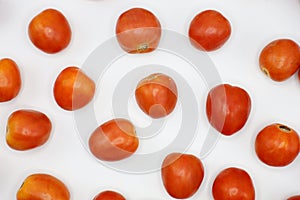 Red tomatoes with white background. photo