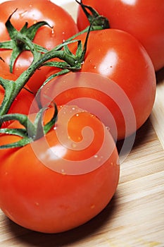 Red tomatos on a vine