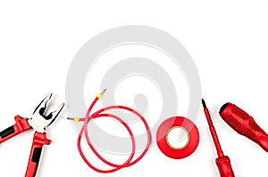 Red tools collection - electrical cable, pliers, insulating tape