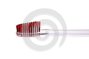 Red toothbrush isolated on white background