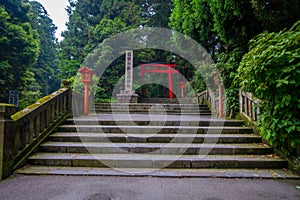 Red Tori Gate at Fushimi Inari Shrine, with stoned stairs located in Kyoto, Japan