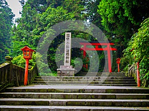 Red Tori Gate at Fushimi Inari Shrine, with stoned stairs located in Kyoto, Japan