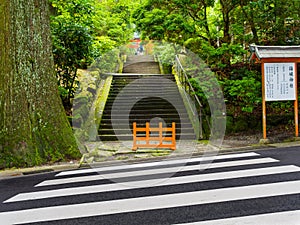 Red Tori Gate at Fushimi Inari Shrine, with stoned stairs located in Kyoto, Japan