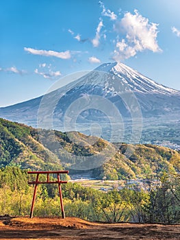 Red torii of Chureito temple with Mountain Fuji as background