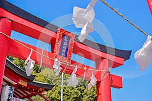 A red torii in Japan with blue sky