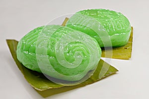 Red Tortoise Cakes or Ang Ku Kueh, a traditional Chinese pastry, seen here with green glutinous rice flour skin