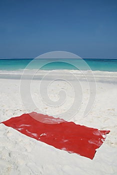 Red towel on beatiful beach