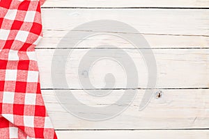 Red towel over wooden kitchen table