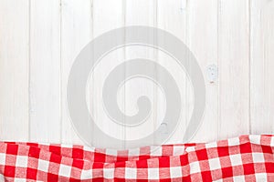 Red towel over wooden kitchen table