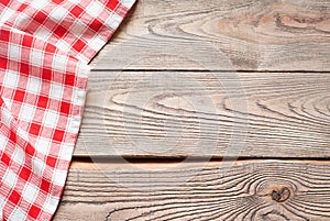 Red towel over wooden kitchen table