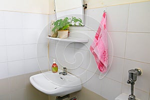 Red towel for wipe hand in toliet room on wall