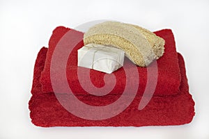 Red towels with soap and luffa