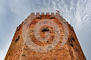 Red tower Kizil Kule in Alanya on a cloudy day
