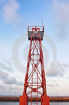 A red tower rises above the beach to monitor the traffic of fishing boats in the coastal waters of Cilacap Indonesia 4 Sept 20