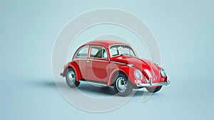 A red toy car on a gray background