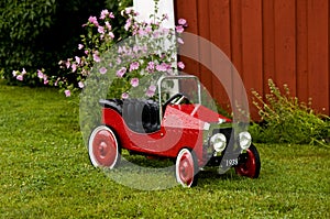 Red Toy Car Outside House