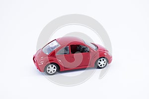 Red toy car with white background.