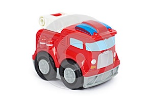 Red toy firefighter car, isolated on white background, fire truck engine