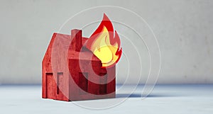 Red toy house with fire symbol