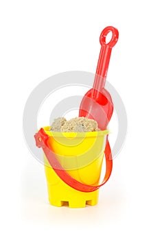 Red toy shovel and a yellow bucket
