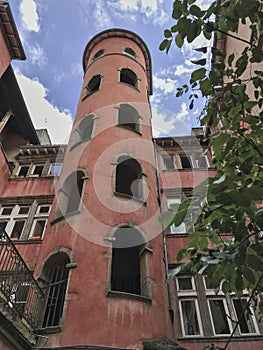 Red Traboule in Lyon, France, with blue sky